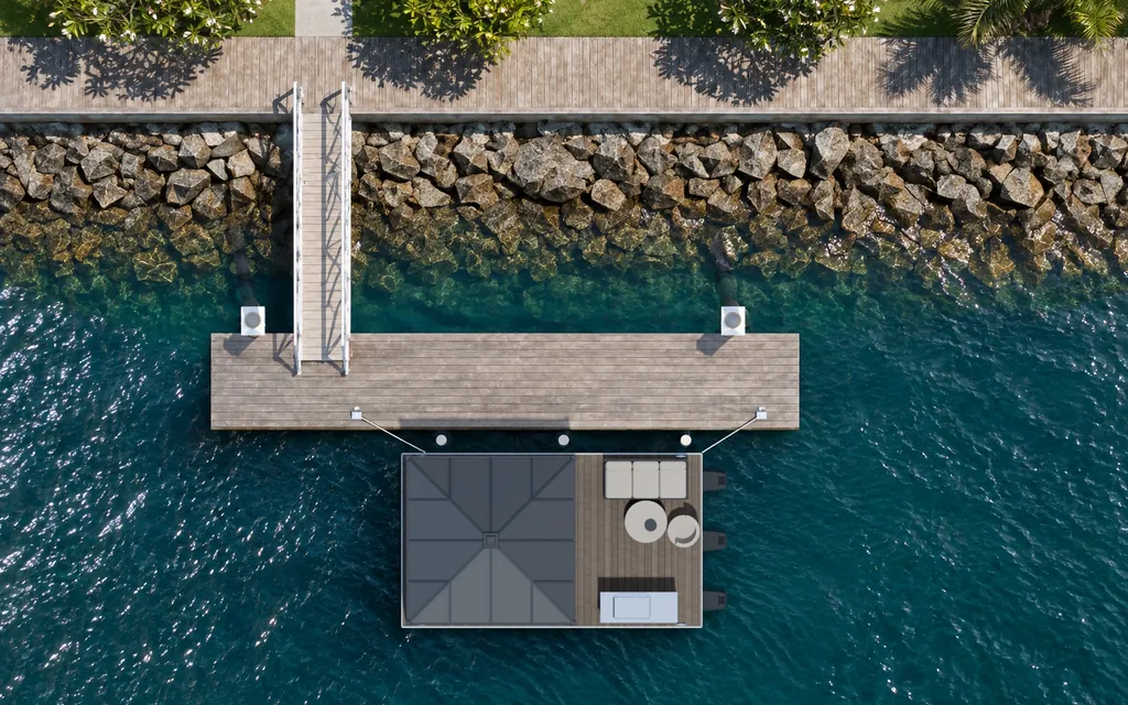 Straight-down aerial view of the Driftroom Pavilion moored beside a canal pontoon
